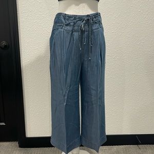 Jean colored wide leg capri pants with zippered back and tie waist.